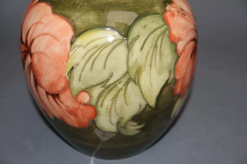 A Moorcroft hibiscus pattern jar and cover, height 20cm